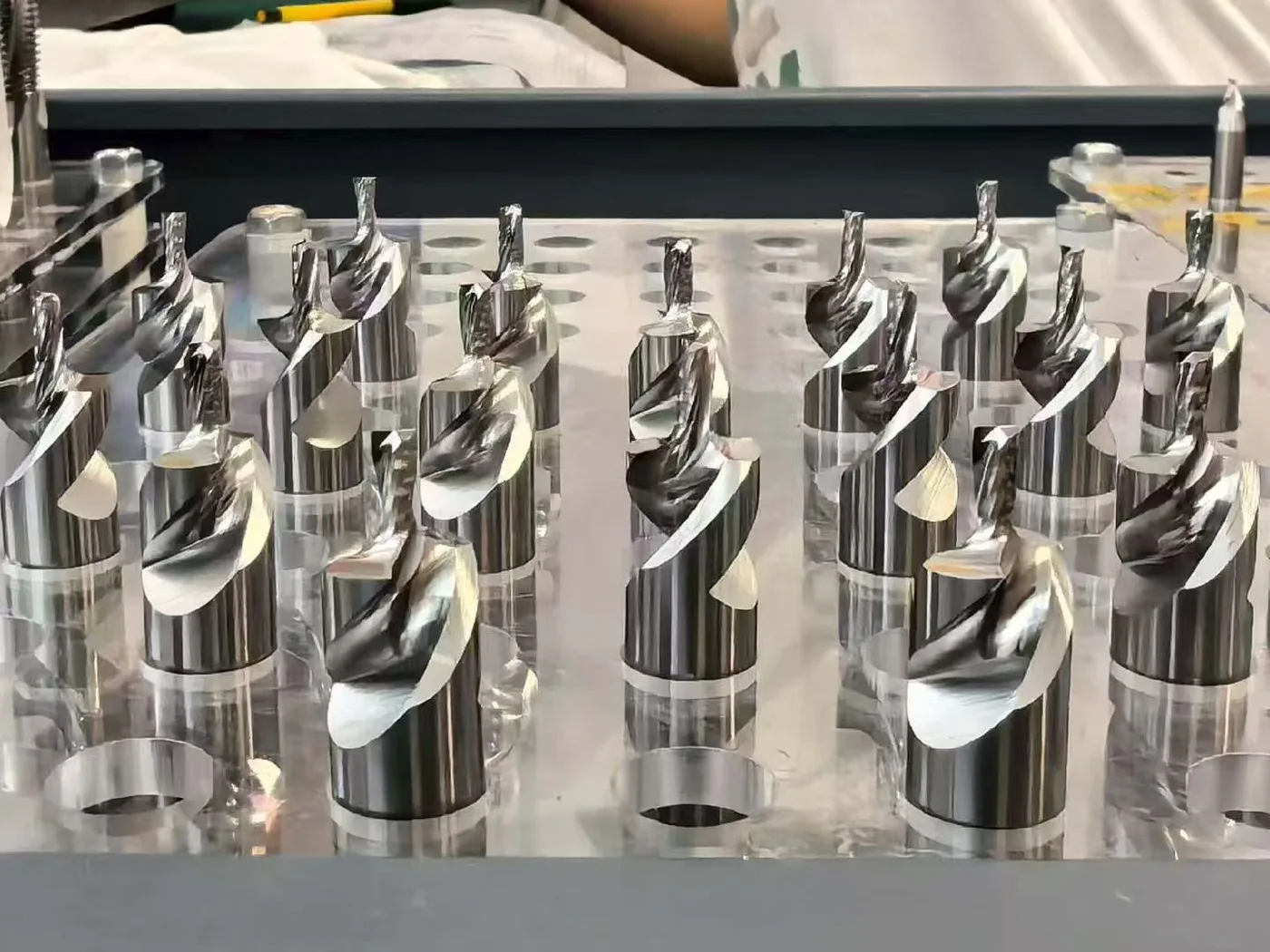 Assorted custom cutting tools with varied stepped and profiled geometries in a tool holder