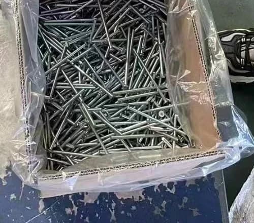 Long screw components collected in a bulk lot