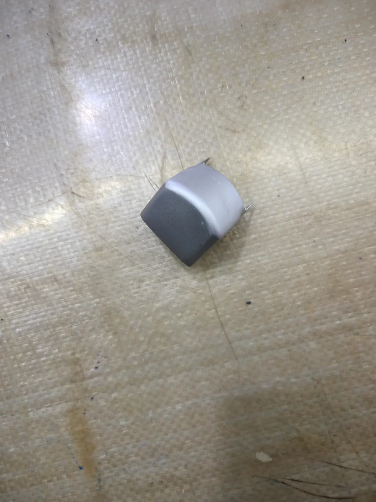 Small curved metal cover with a formed profile