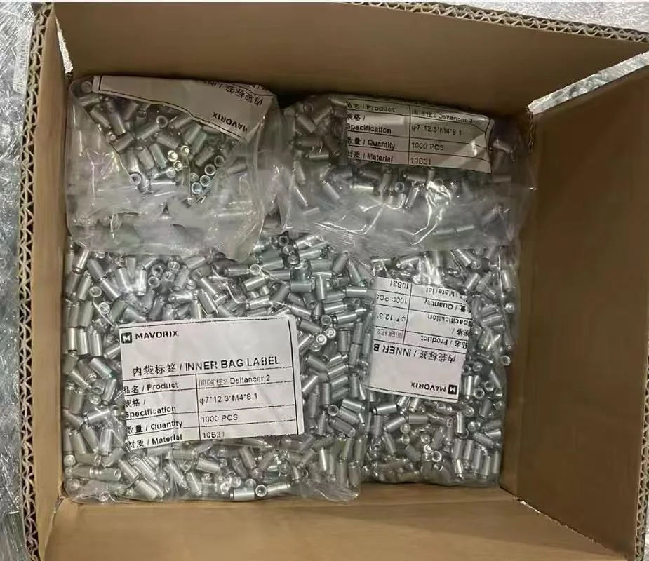 Two labeled inner packs of steel spacer components inside an export carton