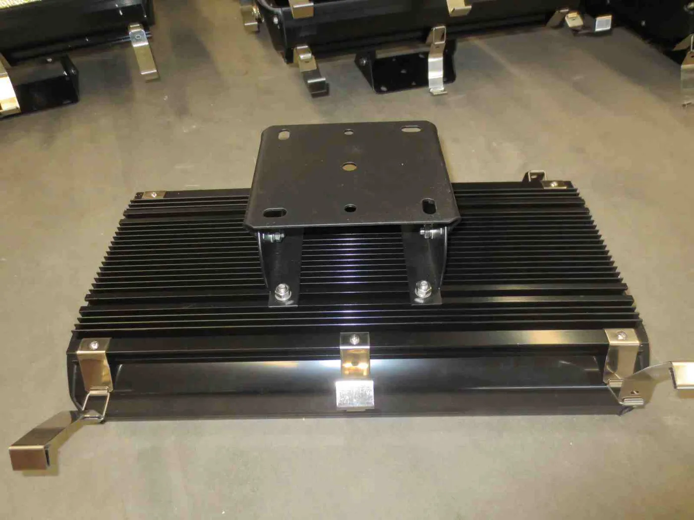 Industrial LED flood light with finned heat sink and adjustable mounting bracket