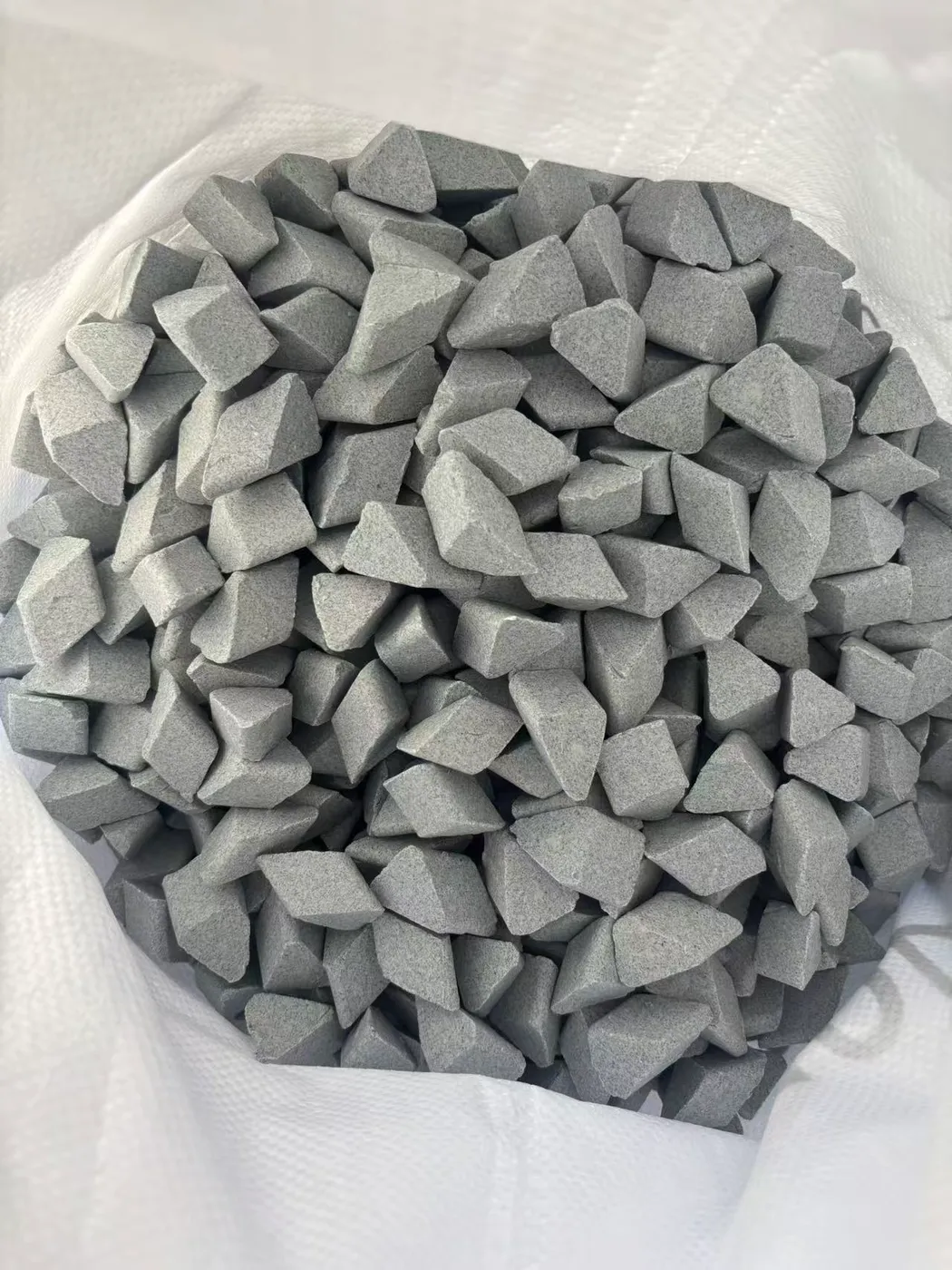 Close-up of TR-T 20×20 ceramic abrasive media