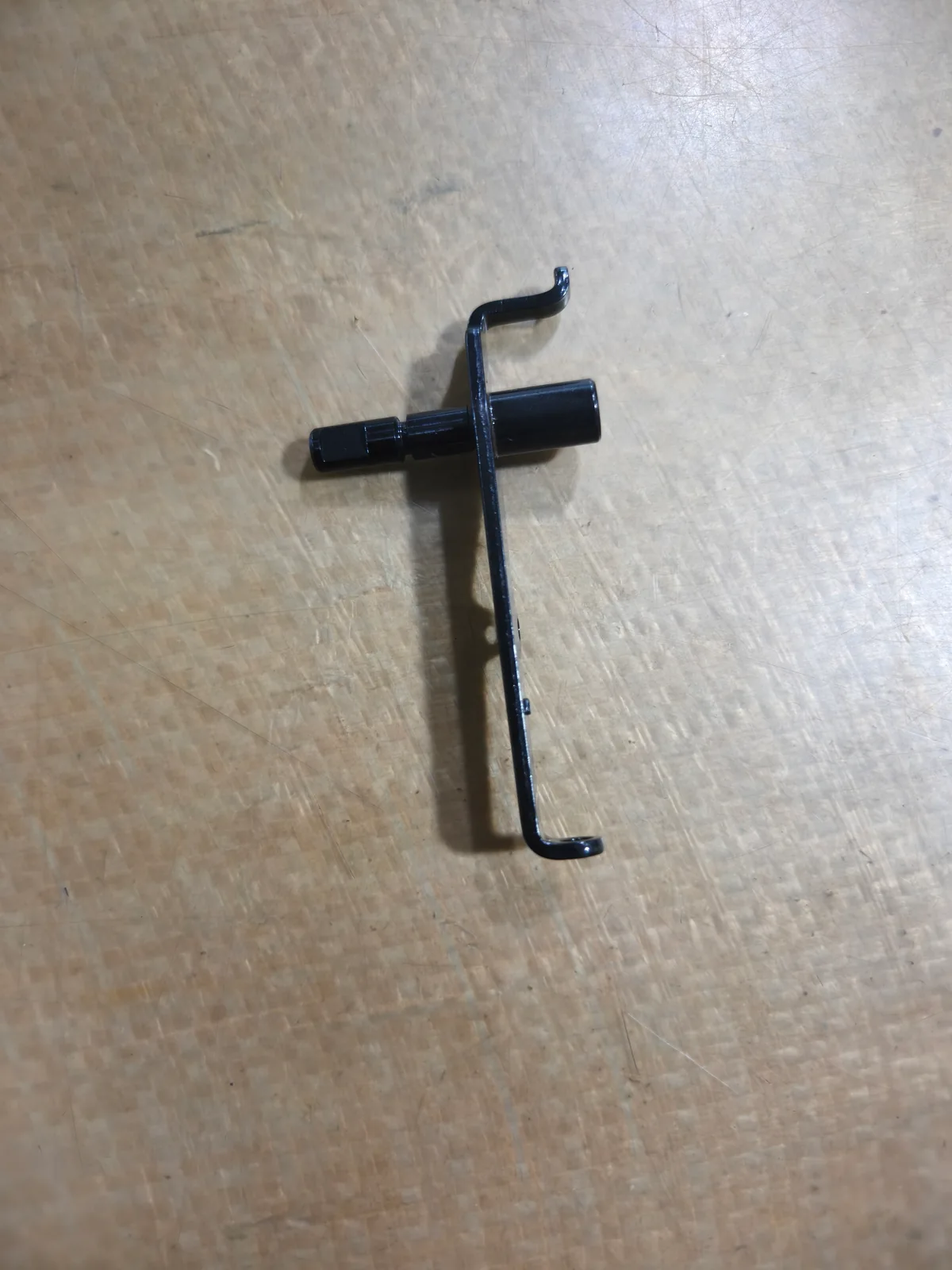 Metal lever with a cylindrical sleeve and formed ends